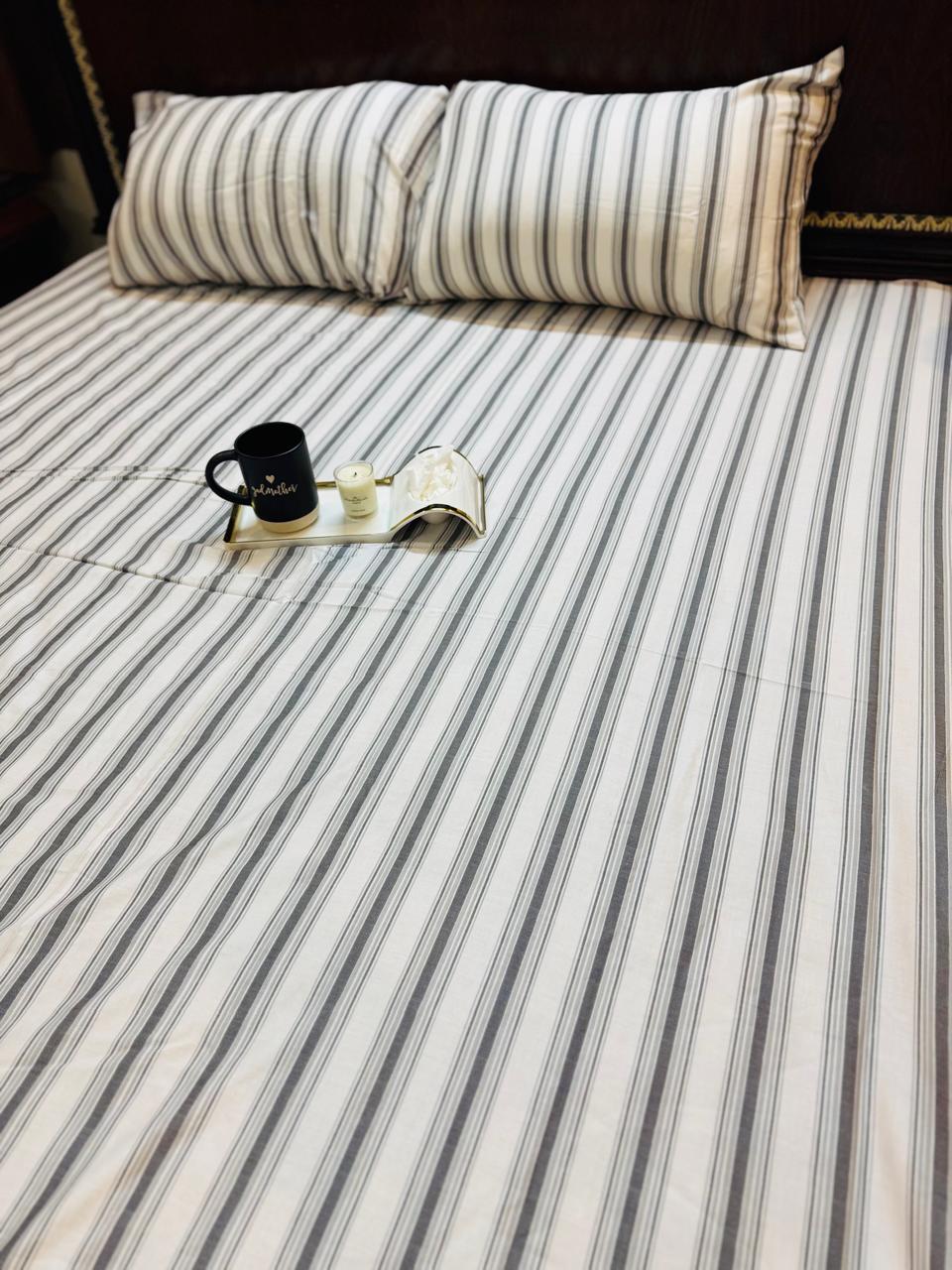 BEDSHEET with 2pillow cases.